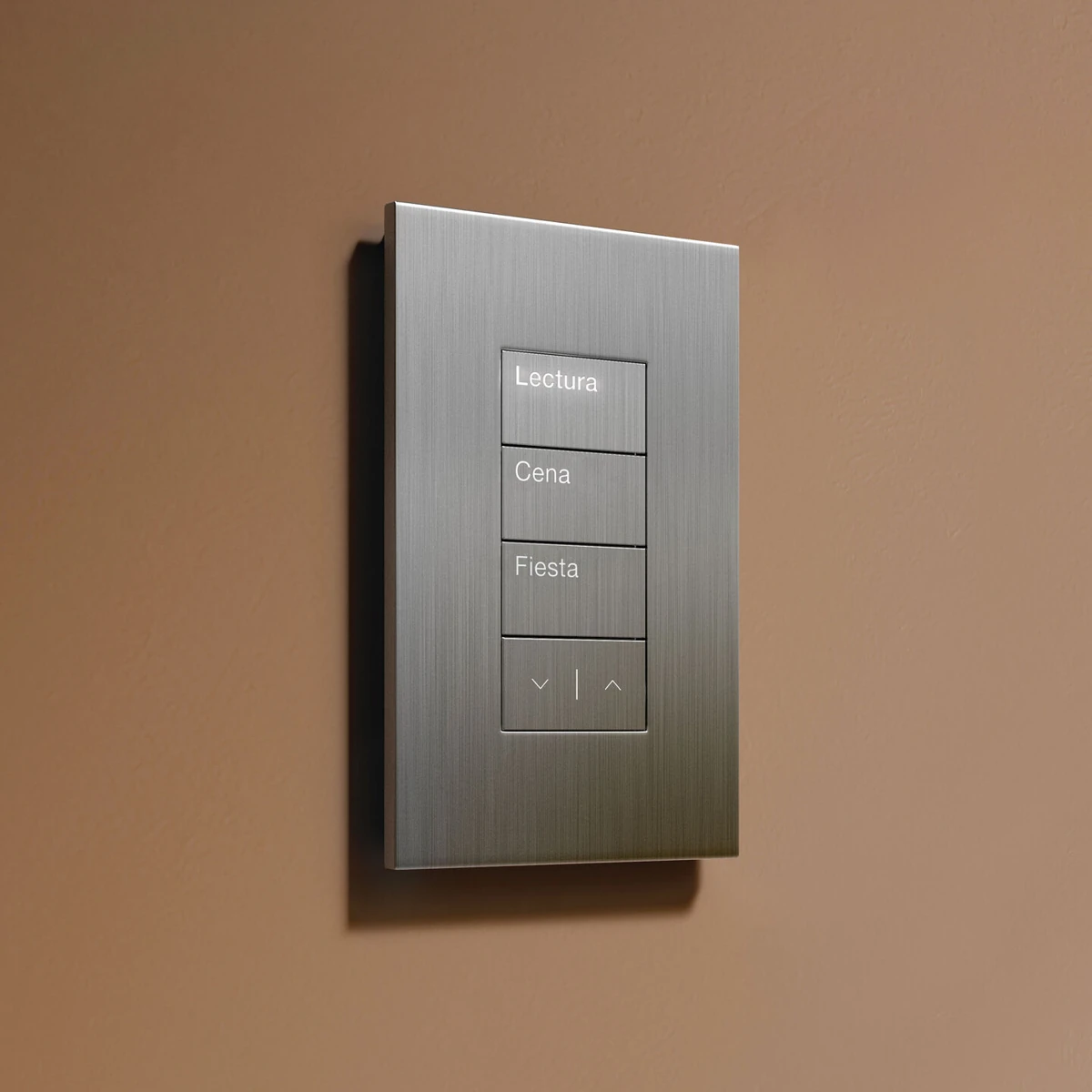 Palladiom keypad in satin-nickel appearance, mounted on a warm plaster wall; buttons engraved Lectura, Cena, Fiesta, Down / Up arrow icons